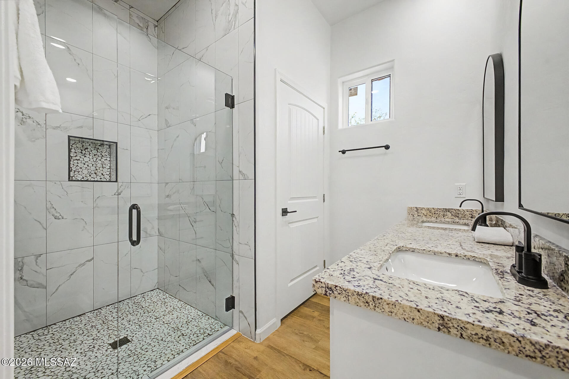 4601 East Magoo Road Tucson, AZ 85739 - Photo 13 of 38 a bathroom with a granite countertop sink a toilet and shower