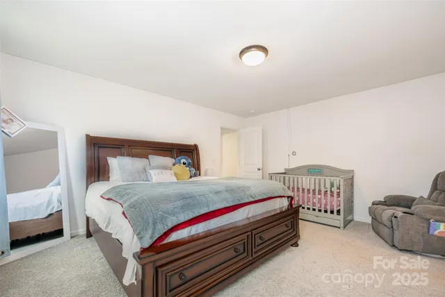 a bedroom with a bed and a couch