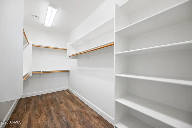 a view of an empty walk in closet