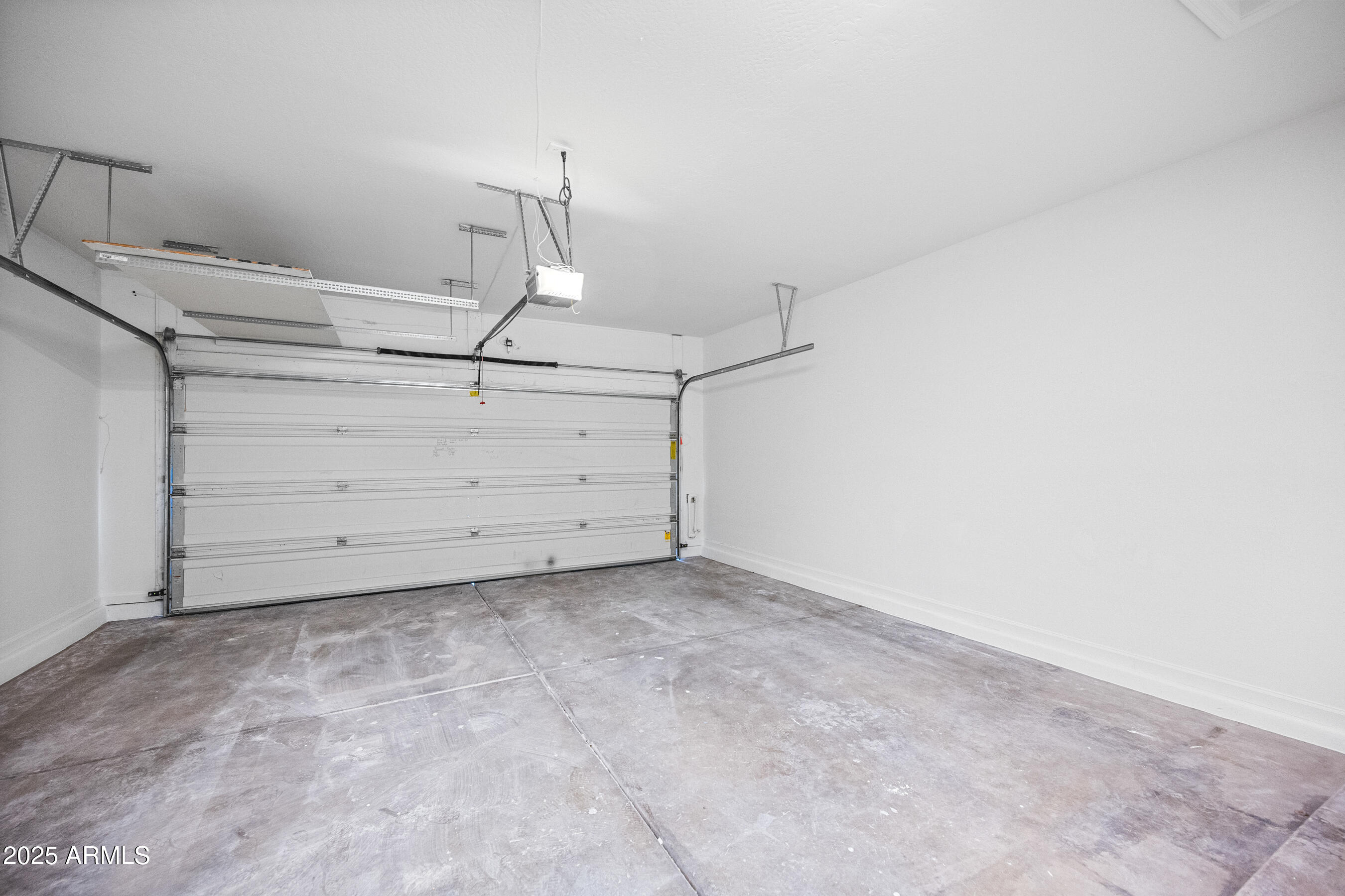 10805 West Woodland Avenue Avondale, AZ 85323 - Photo 23 of 25 a view of a room with racks on the wall