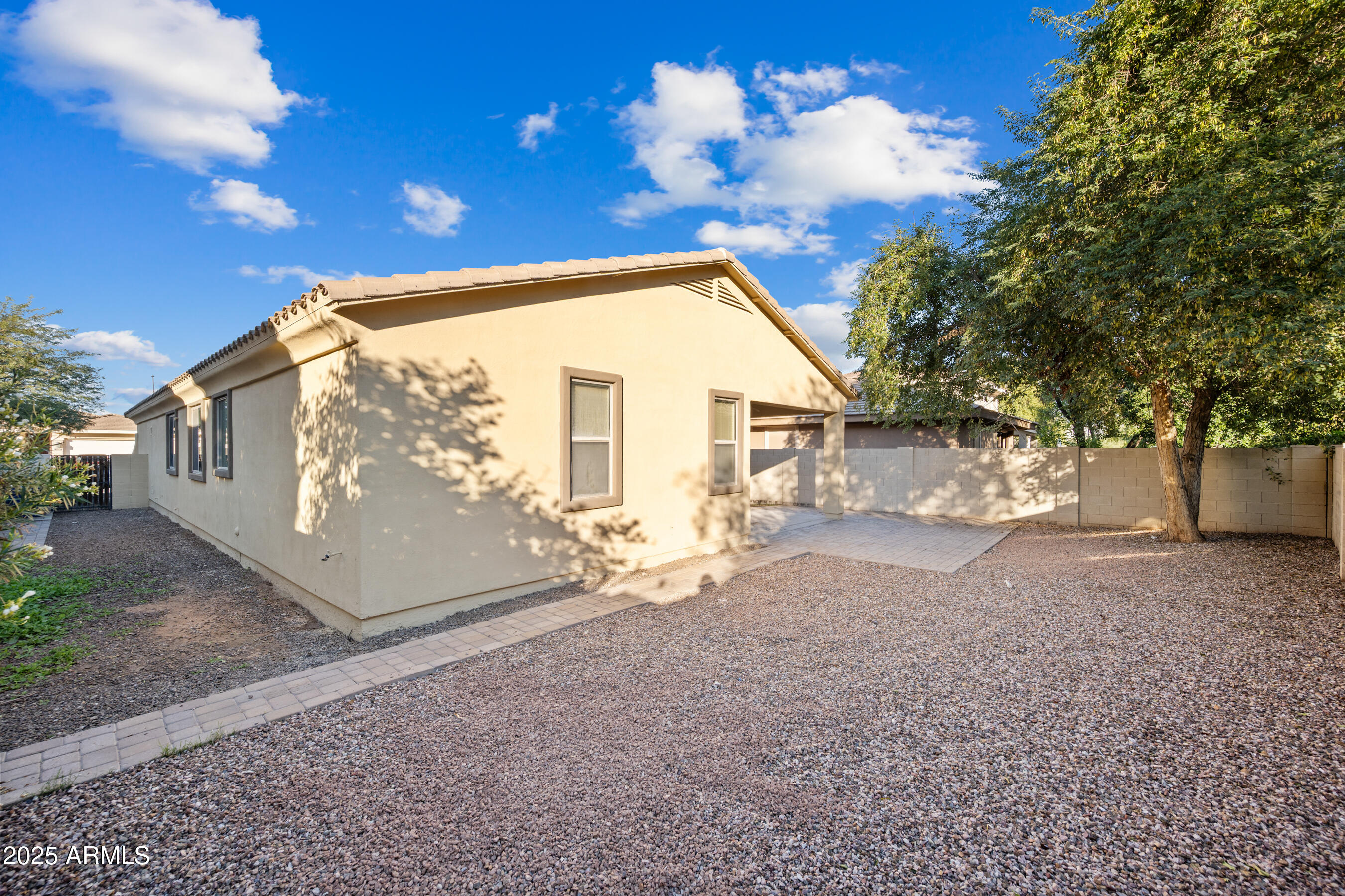 10805 West Woodland Avenue Avondale, AZ 85323 - Photo 25 of 25 a view of a house with a yard
