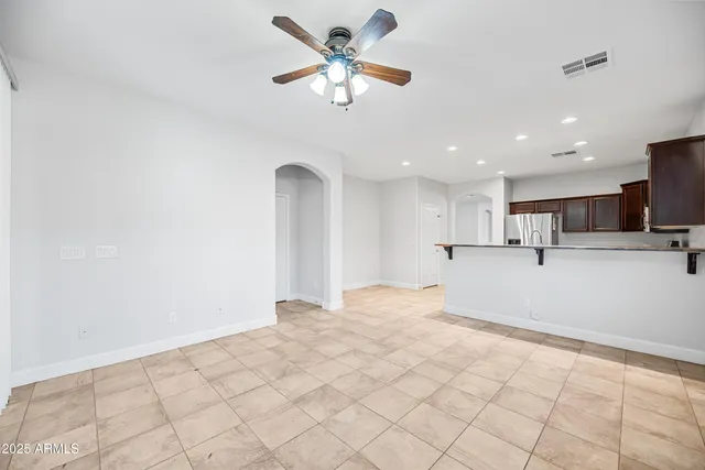 a view of a kitchen with a sink and cabinets