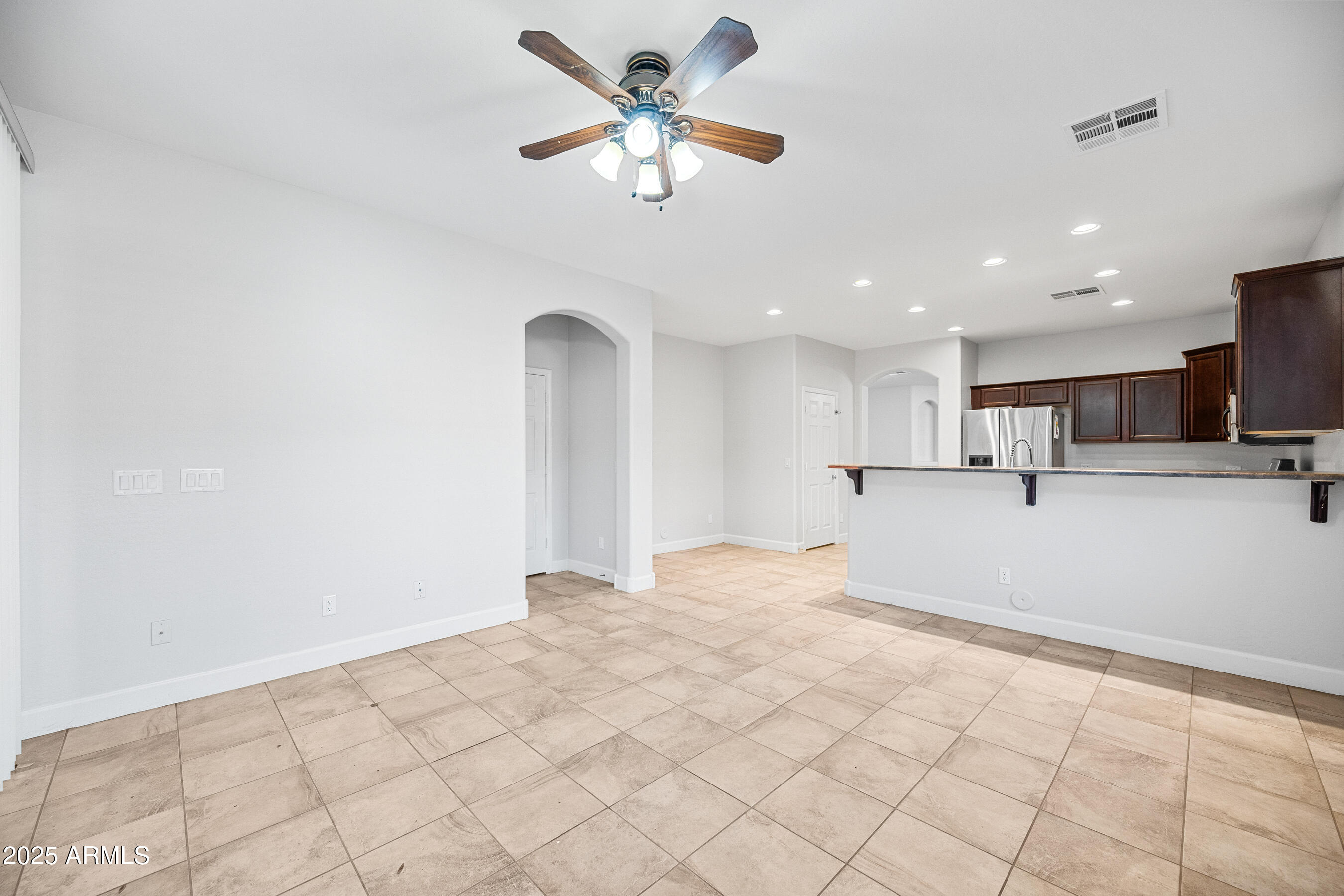 10805 West Woodland Avenue Avondale, AZ 85323 - Photo 8 of 25 a view of a kitchen with a sink and cabinets