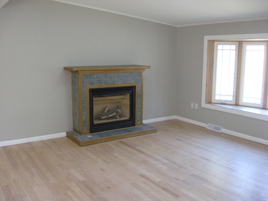 5 Old Amherst Road, Unit 5B Belchertown, MA 01007 - Photo 12 of 37 an empty room with a fireplace
