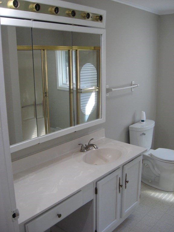 5 Old Amherst Road, Unit 5B Belchertown, MA 01007 - Photo 17 of 37 a bathroom with a sink and a mirror