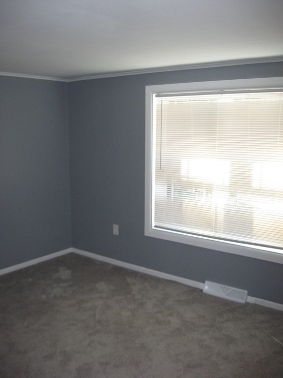 5 Old Amherst Road, Unit 5B Belchertown, MA 01007 - Photo 28 of 37 an empty room with a window