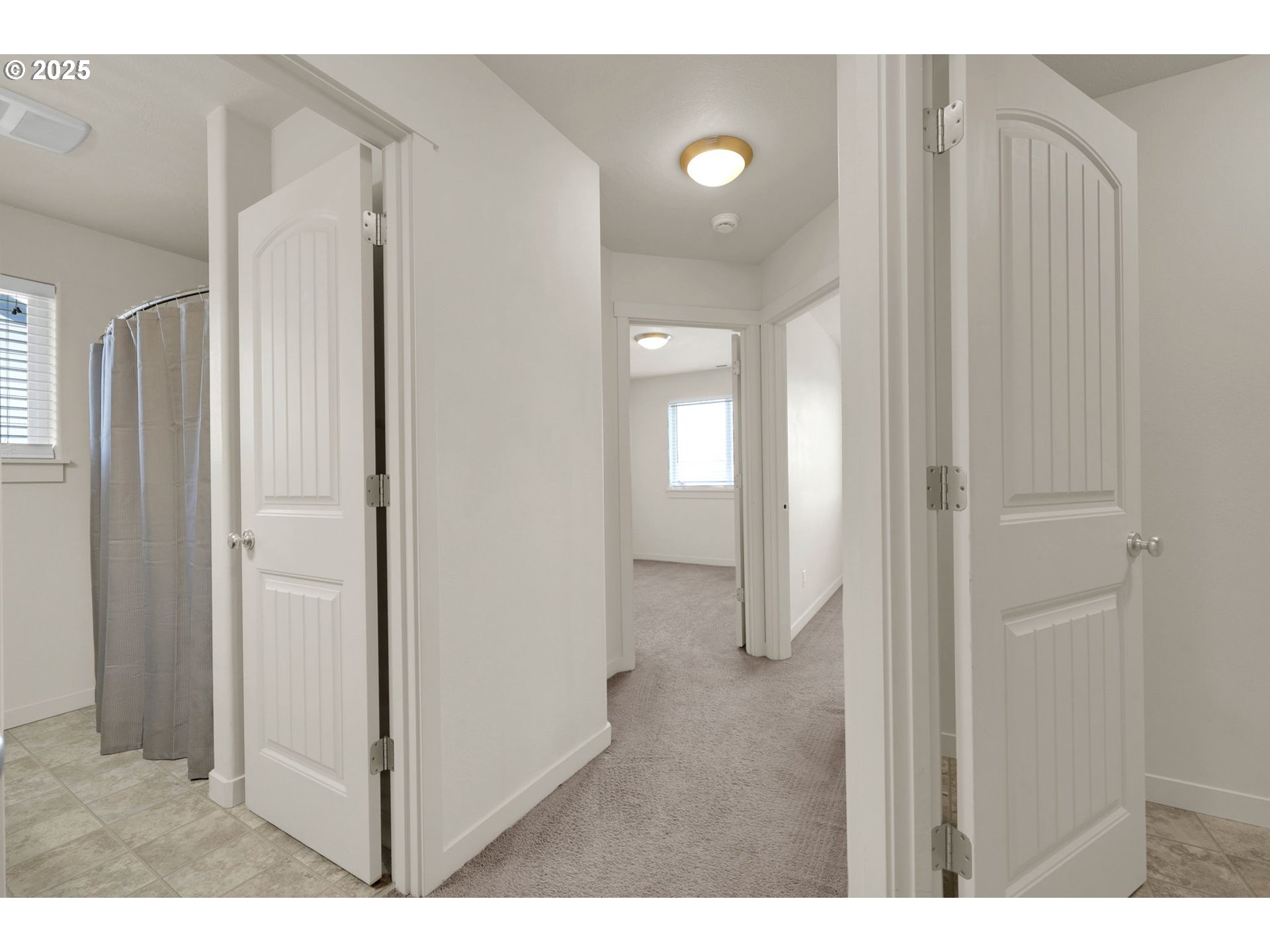 490 Raber Road Eugene, OR 97402 - Photo 18 of 37 a view of a bathroom with a shower and a sink
