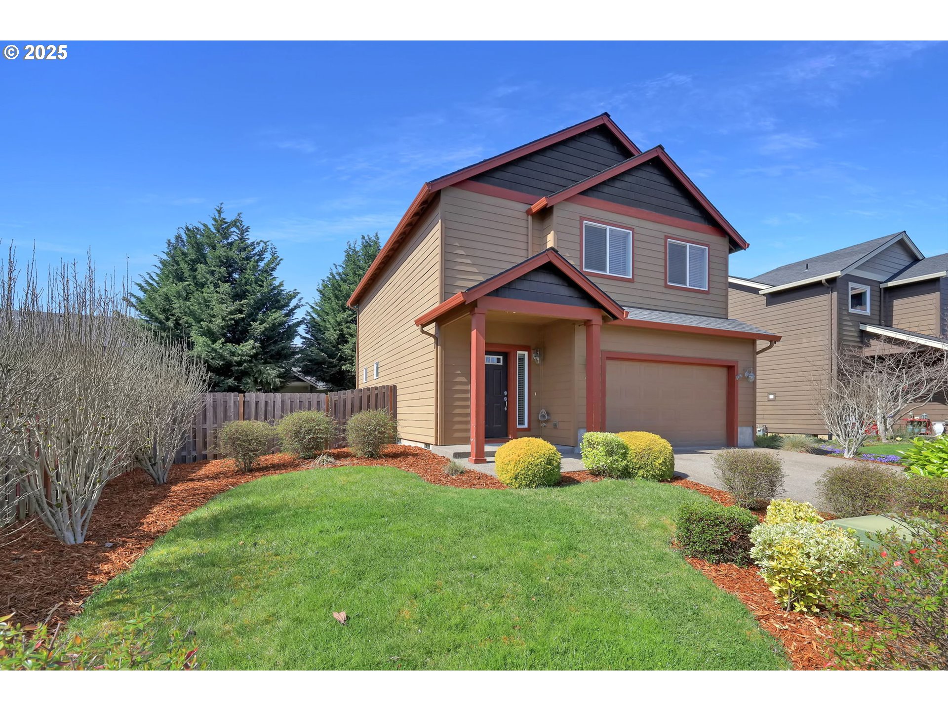 490 Raber Road Eugene, OR 97402 - Photo 2 of 37 a front view of a house with a yard and trees