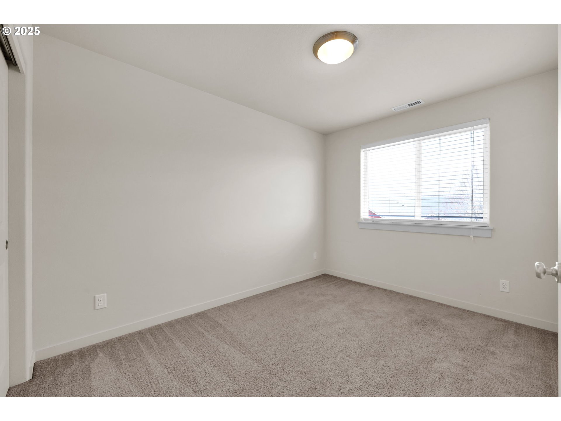 490 Raber Road Eugene, OR 97402 - Photo 22 of 37 a view of an empty room with a window