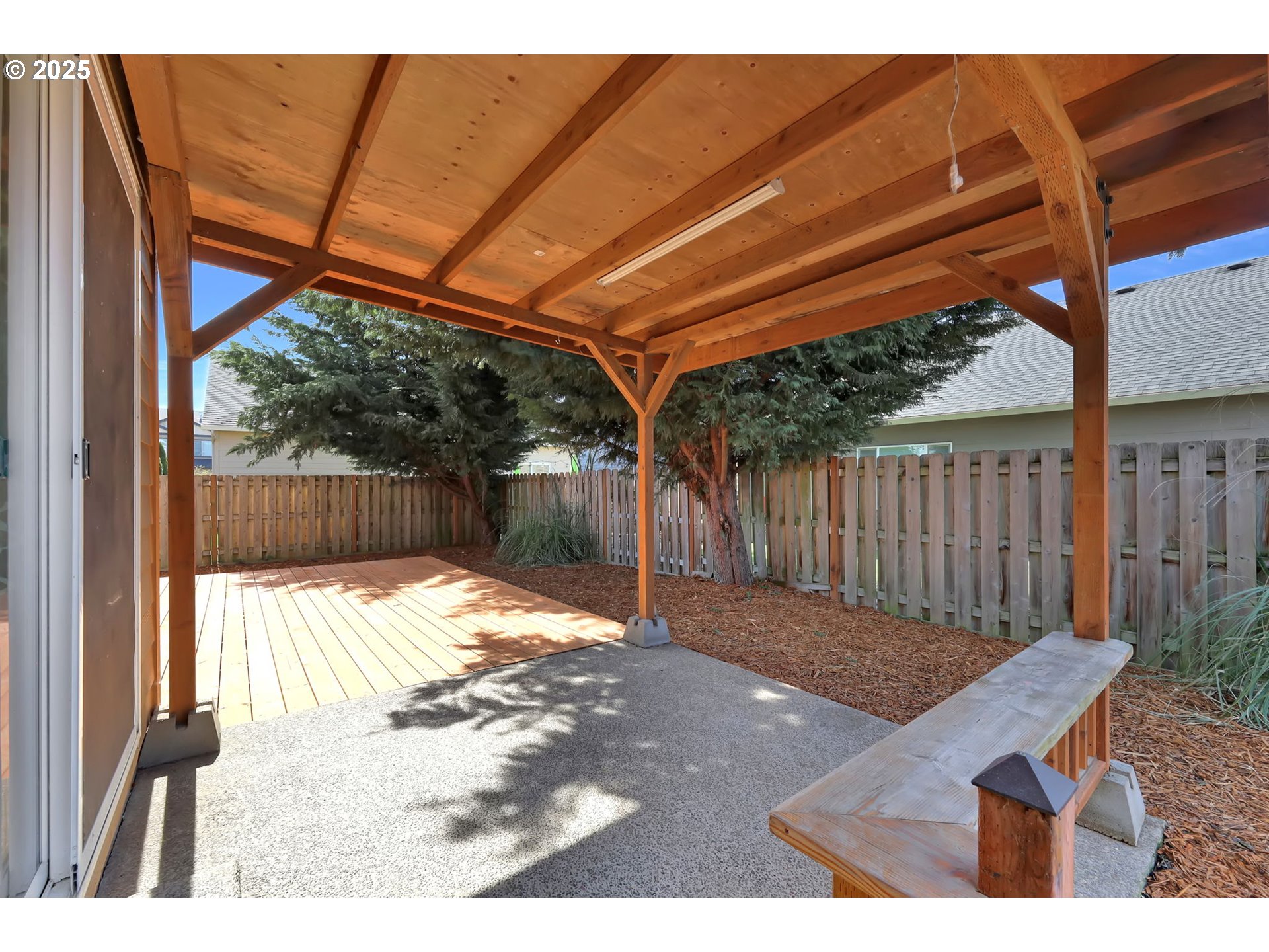 490 Raber Road Eugene, OR 97402 - Photo 35 of 37 a view of a backyard with a small cabin and wooden chair