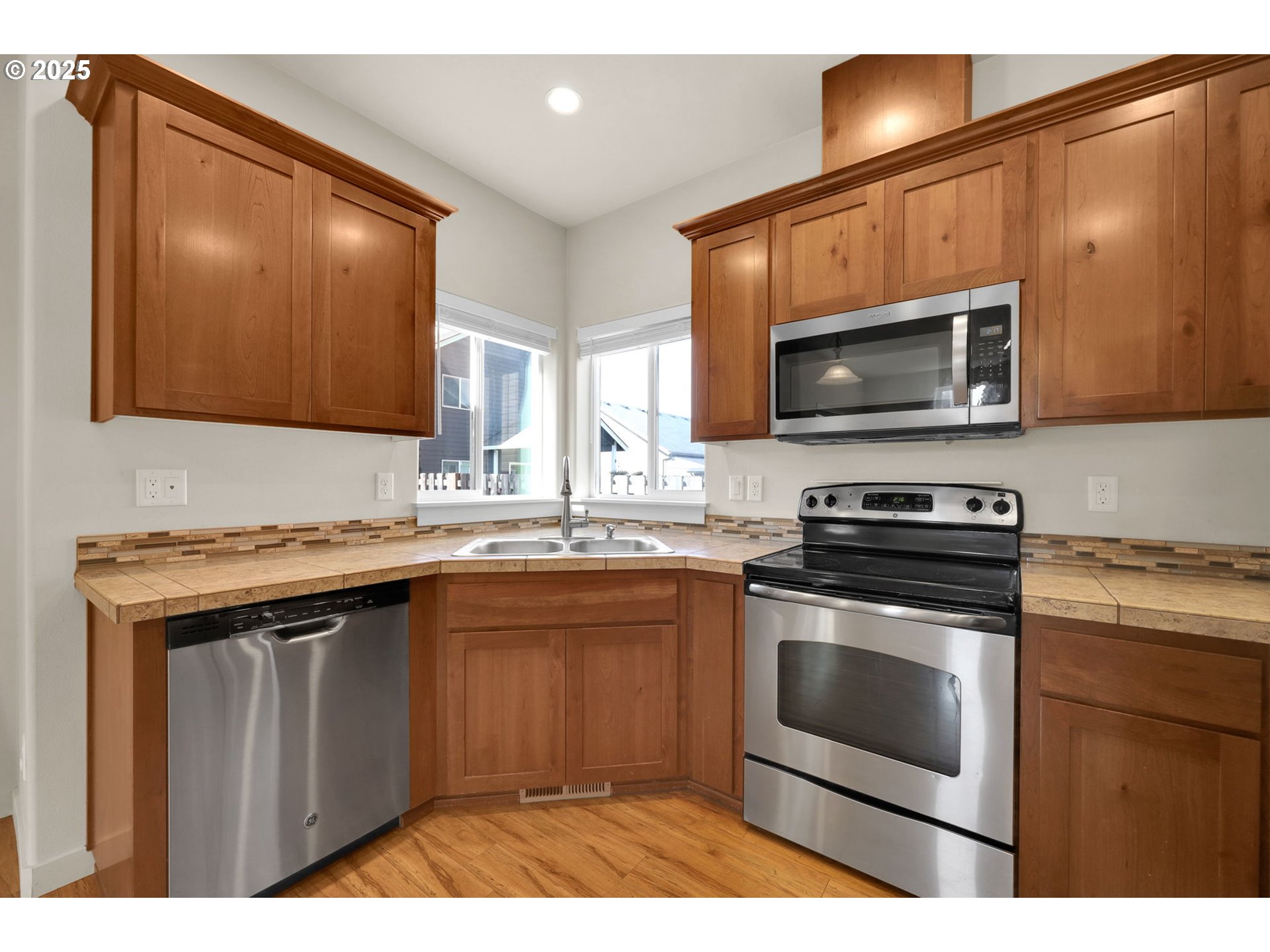 490 Raber Road Eugene, OR 97402 - Photo 7 of 37 a kitchen with a sink stove and microwave