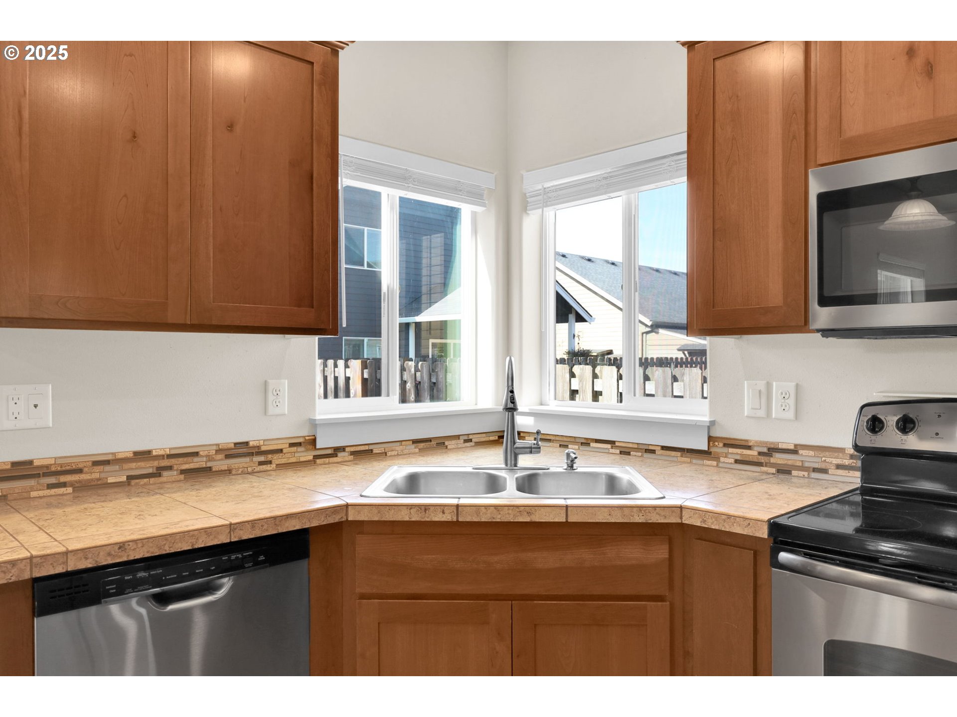 490 Raber Road Eugene, OR 97402 - Photo 8 of 37 a kitchen with a sink a stove and cabinets
