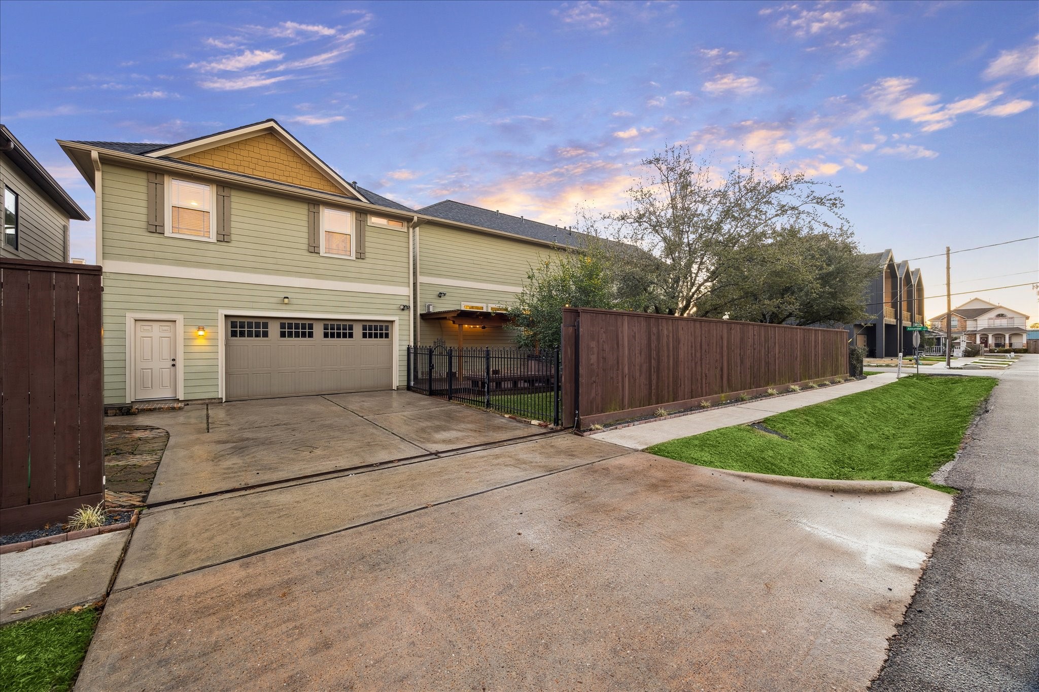 840 Alexander Street Houston, TX 77007 - Photo 33 of 39 Access the expansive driveway from 9th Street via the beautifully reinforced automatic driveway gate. To the left of the entry is extra space for an additional vehicle or RV. A total of 3 vehicles can fit within the gate and 2 additional vehicles in the garage for a total of 5 parking spaces.