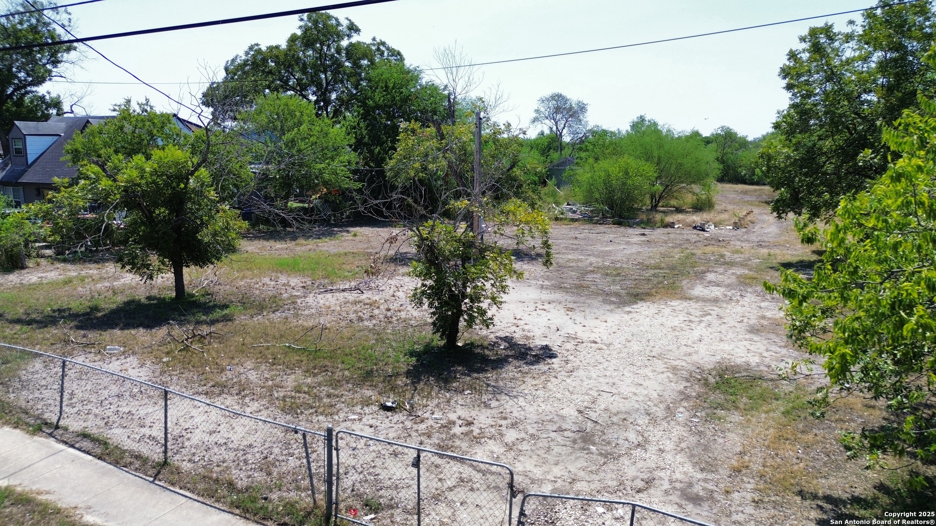 a view of a yard with a tree