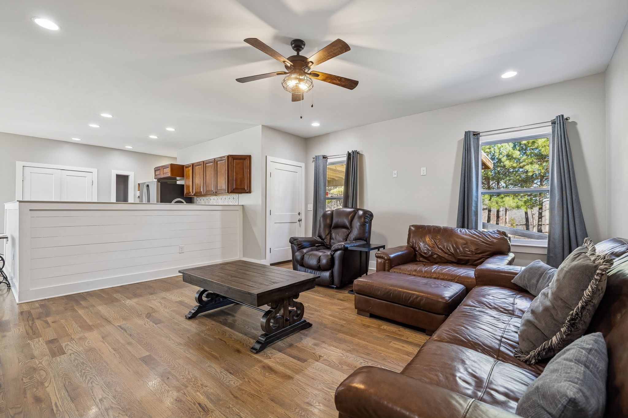 9681 Bud Qurriel Road Bon Aqua, TN 37025 - Photo 12 of 63 a living room with furniture and a ceiling fan