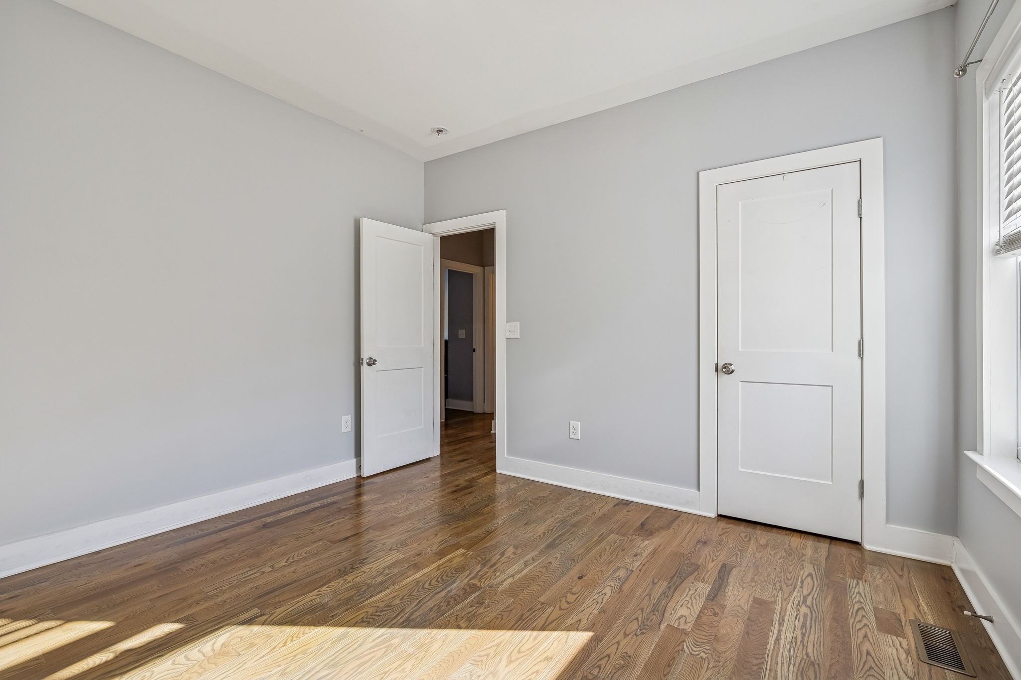 9681 Bud Qurriel Road Bon Aqua, TN 37025 - Photo 27 of 63 a view of an empty room with wooden floor