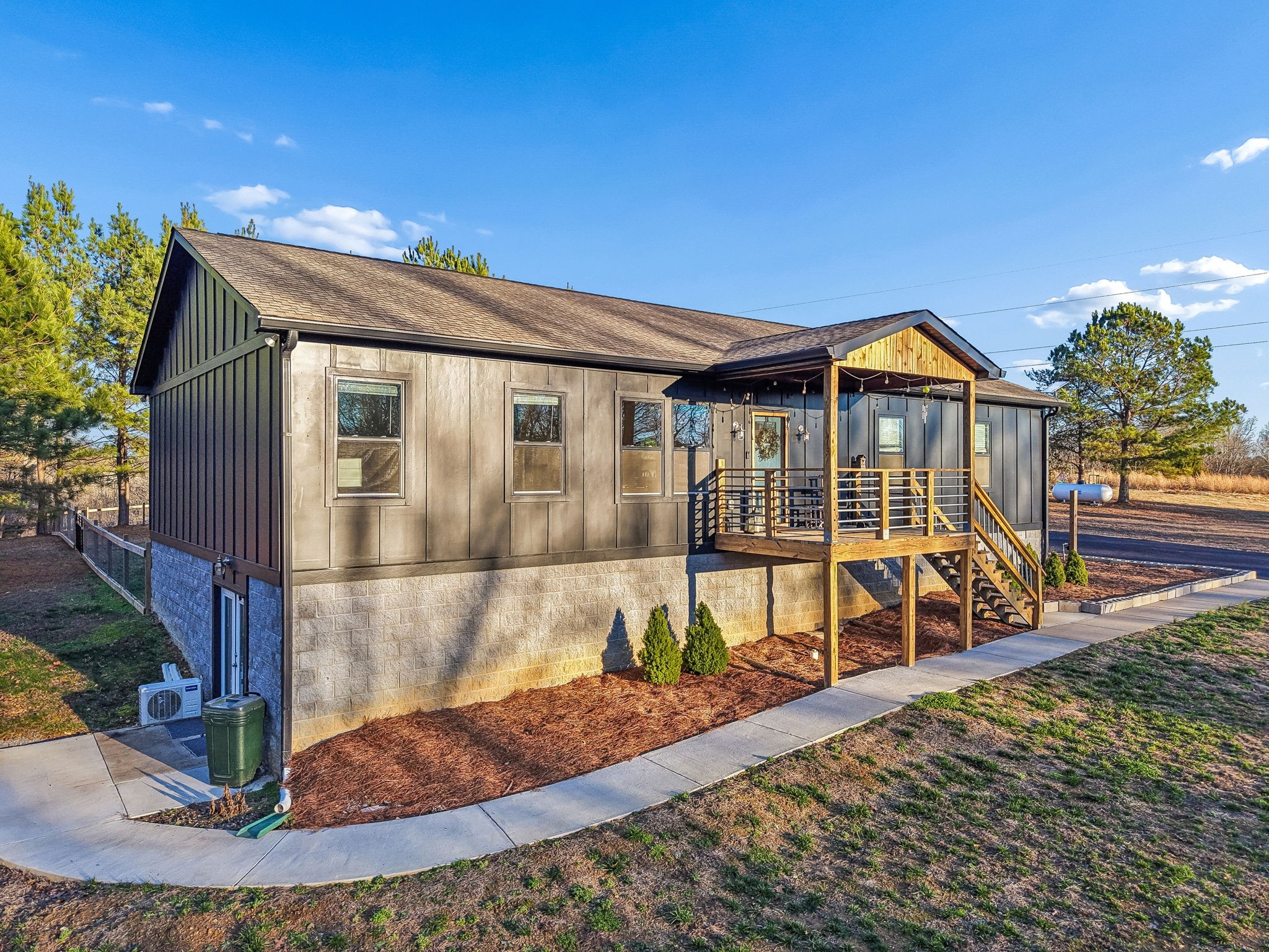 9681 Bud Qurriel Road Bon Aqua, TN 37025 - Photo 3 of 63 a view of a house with a small yard and wooden fence