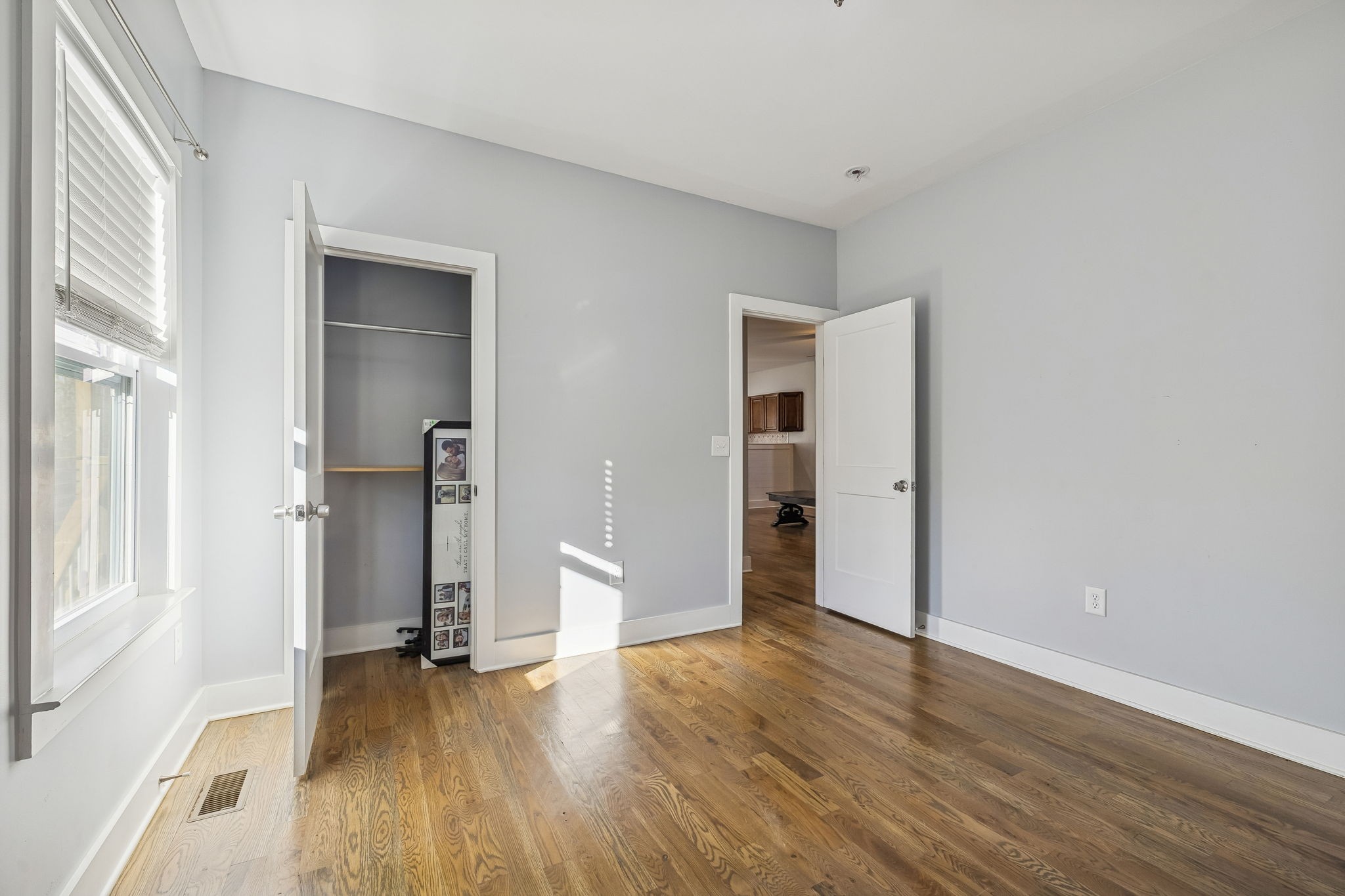 9681 Bud Qurriel Road Bon Aqua, TN 37025 - Photo 34 of 63 a view of empty room with wooden floor