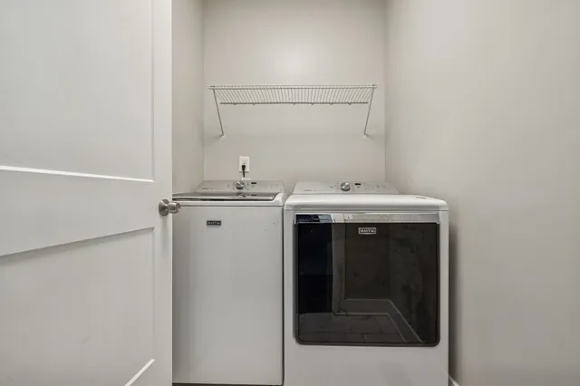 a view of a room with gym equipment and a large window