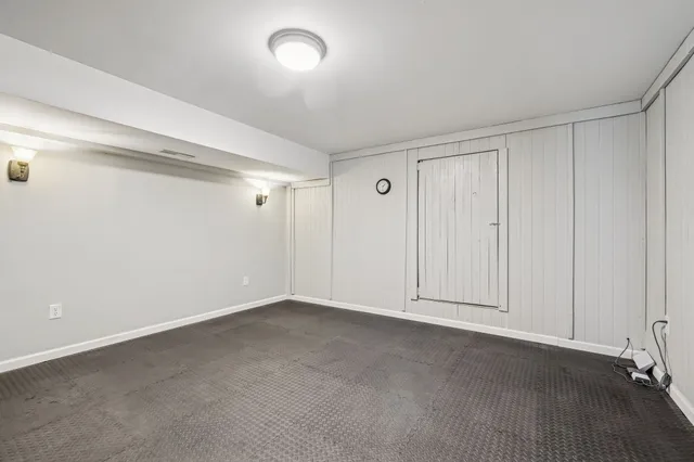 a view of front door with wooden floor