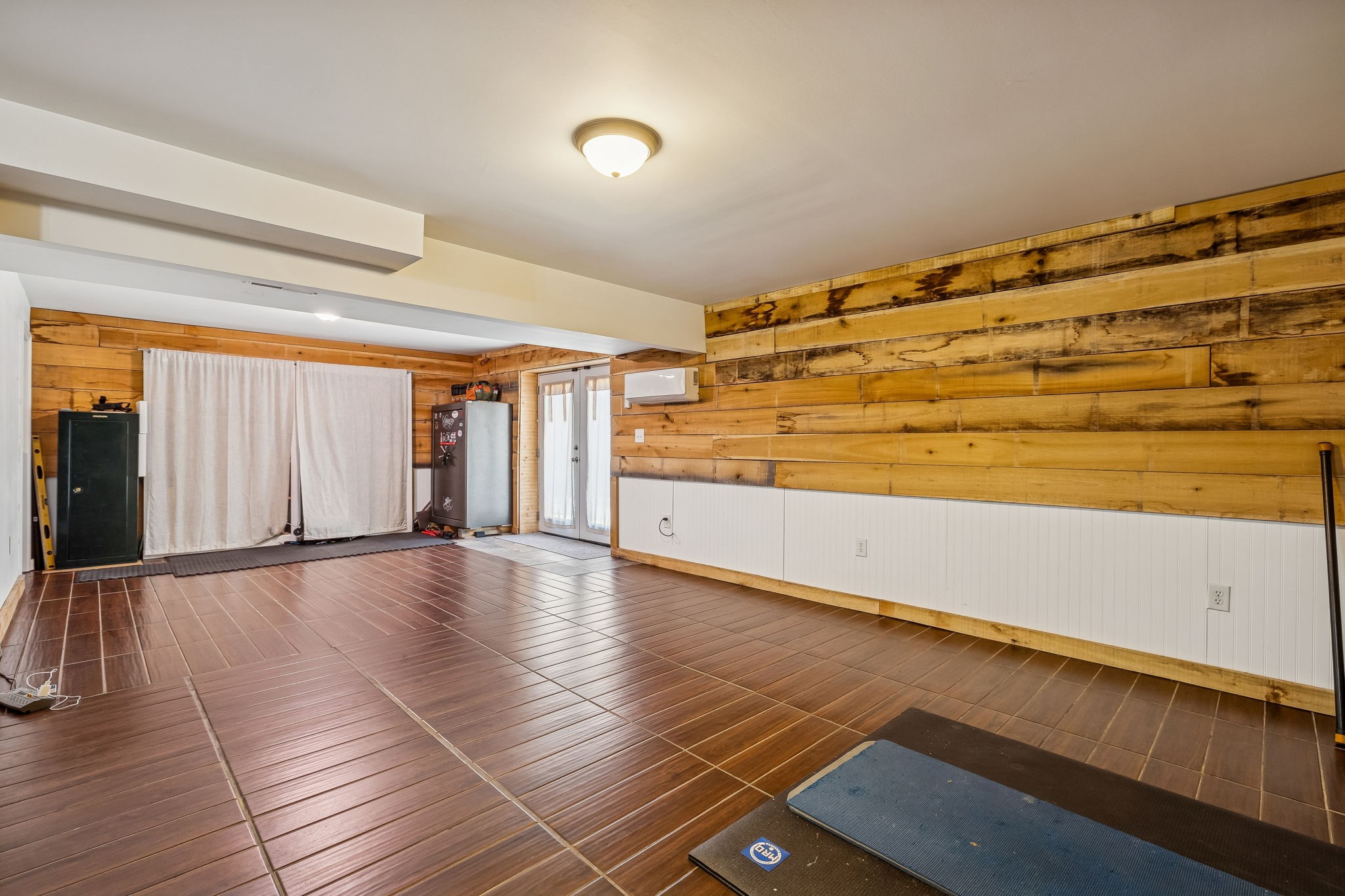 9681 Bud Qurriel Road Bon Aqua, TN 37025 - Photo 38 of 63 a view of an empty room with window and wooden floor