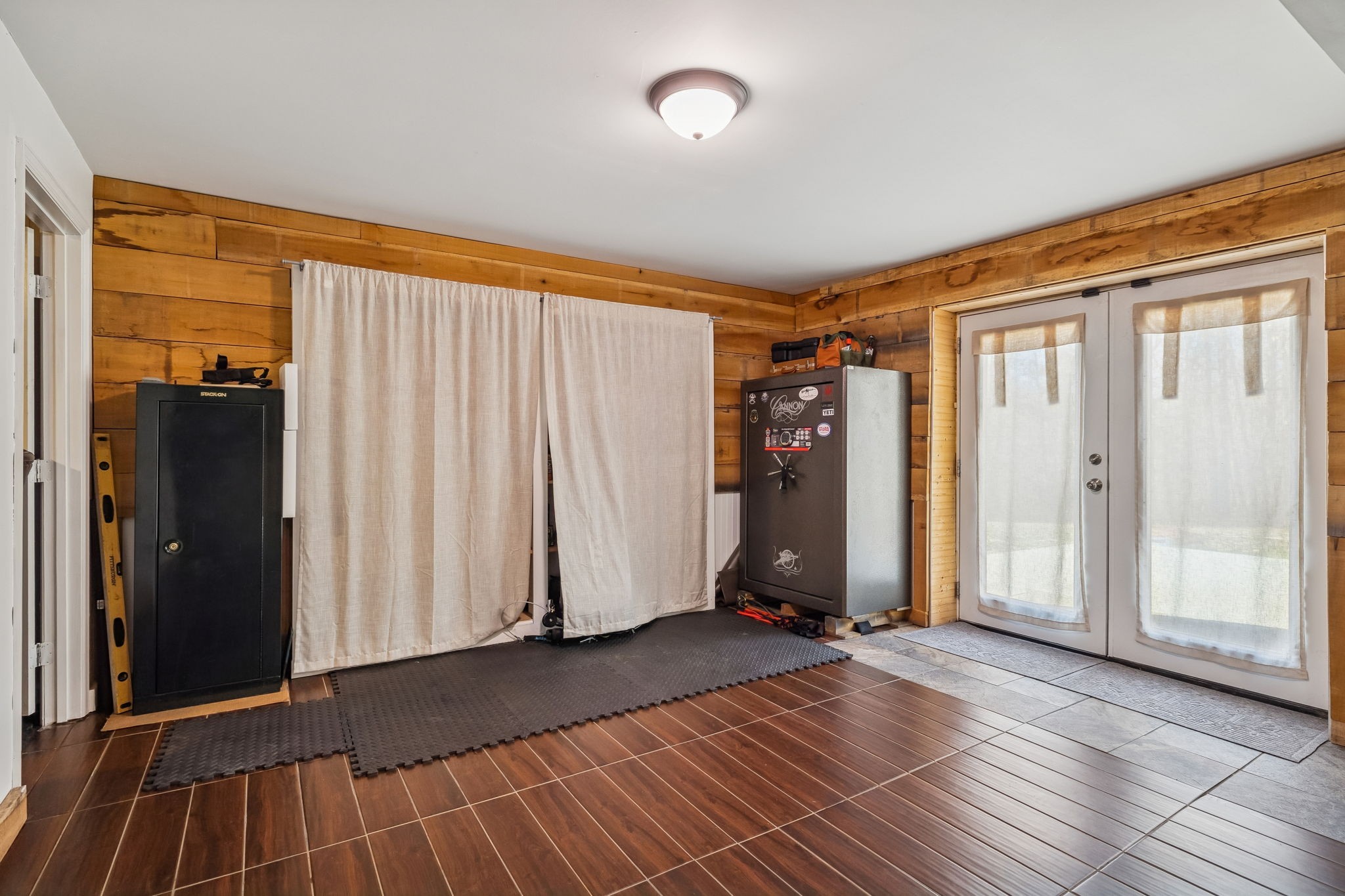 9681 Bud Qurriel Road Bon Aqua, TN 37025 - Photo 40 of 63 a view of front door with wooden floor