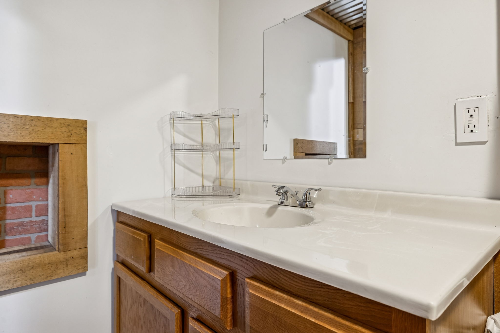 9681 Bud Qurriel Road Bon Aqua, TN 37025 - Photo 42 of 63 a bathroom with a sink and a mirror