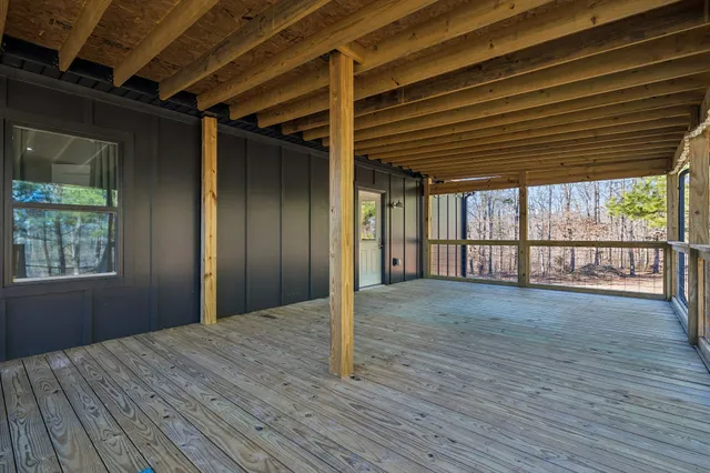 a view of a house with wooden fence