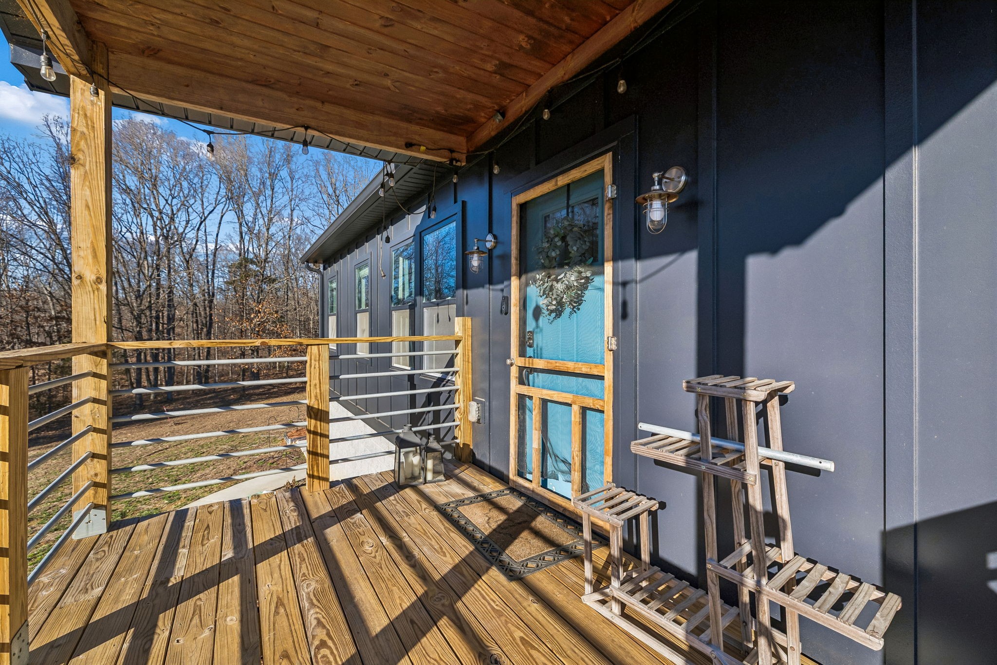 9681 Bud Qurriel Road Bon Aqua, TN 37025 - Photo 5 of 63 a view of balcony with wooden floor