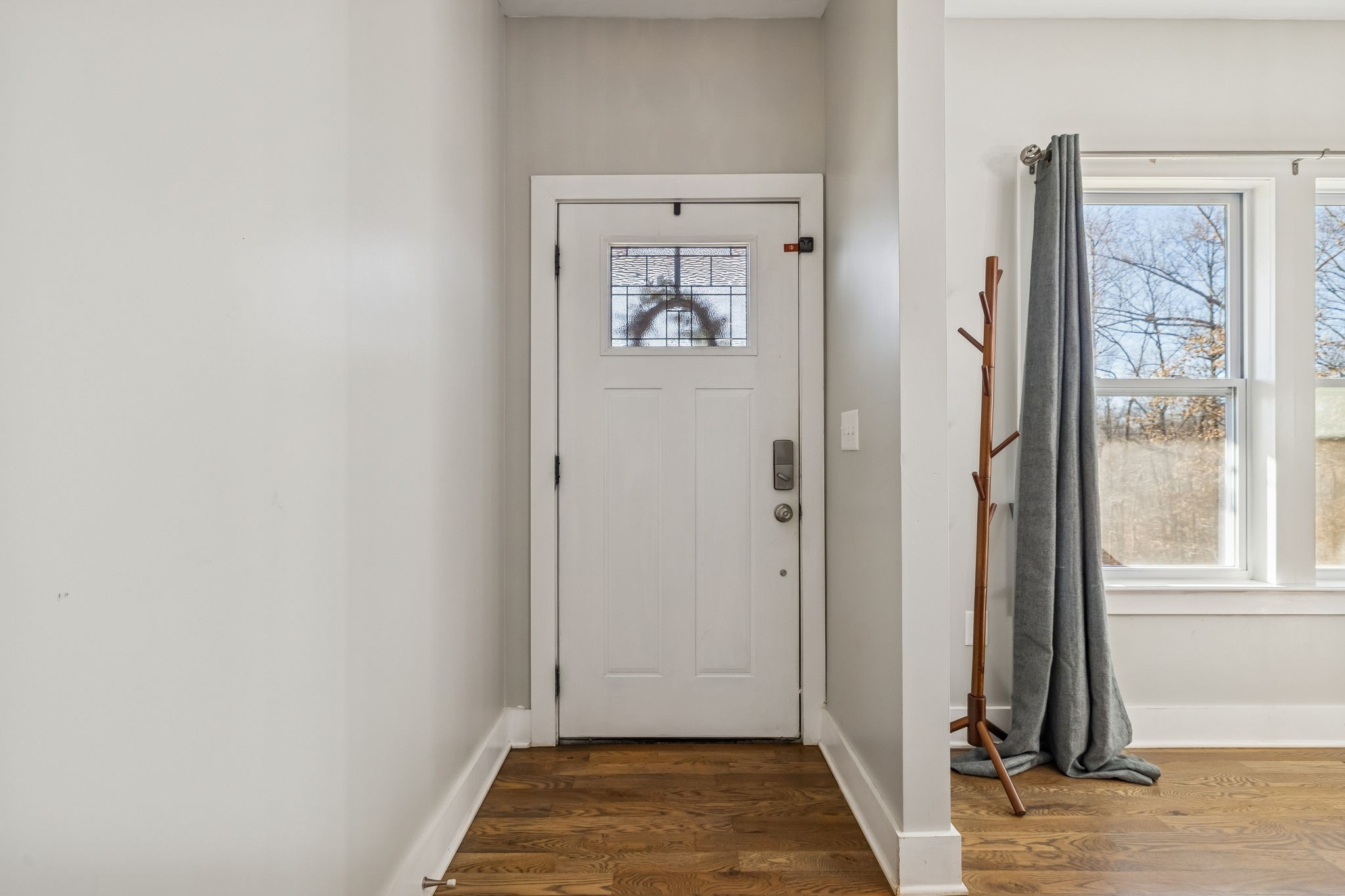 9681 Bud Qurriel Road Bon Aqua, TN 37025 - Photo 9 of 63 a view of an entryway with wooden floor