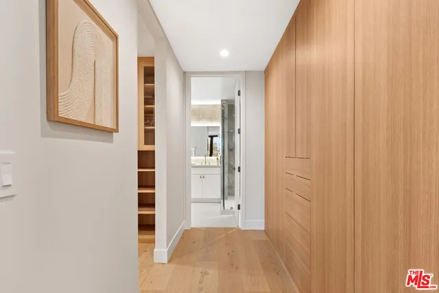 view of a bathroom with shower and a sink