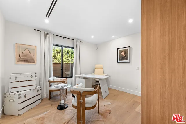 a workspace with furniture and a window