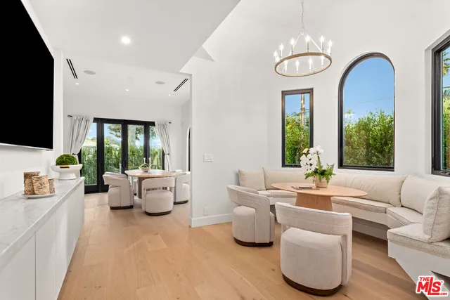 a living room with furniture fireplace and flat screen tv