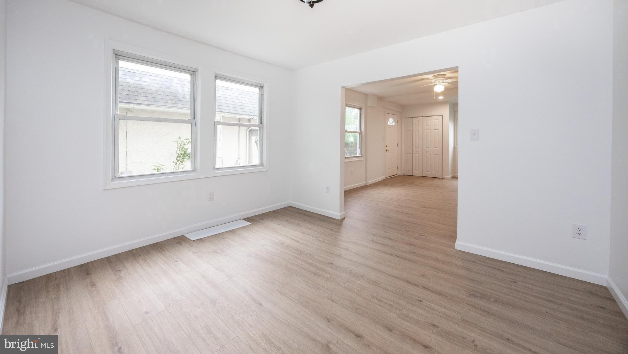 239 Rockingham Road Bryn Mawr, PA 19010 - Photo 3 of 22 an empty room with wooden floor and windows