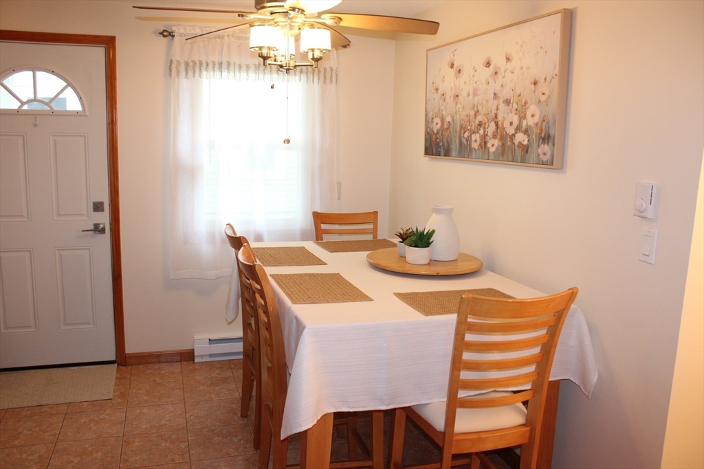 28 State Street Chicopee, MA 01013 - Photo 9 of 25 a dining room with a table and chairs