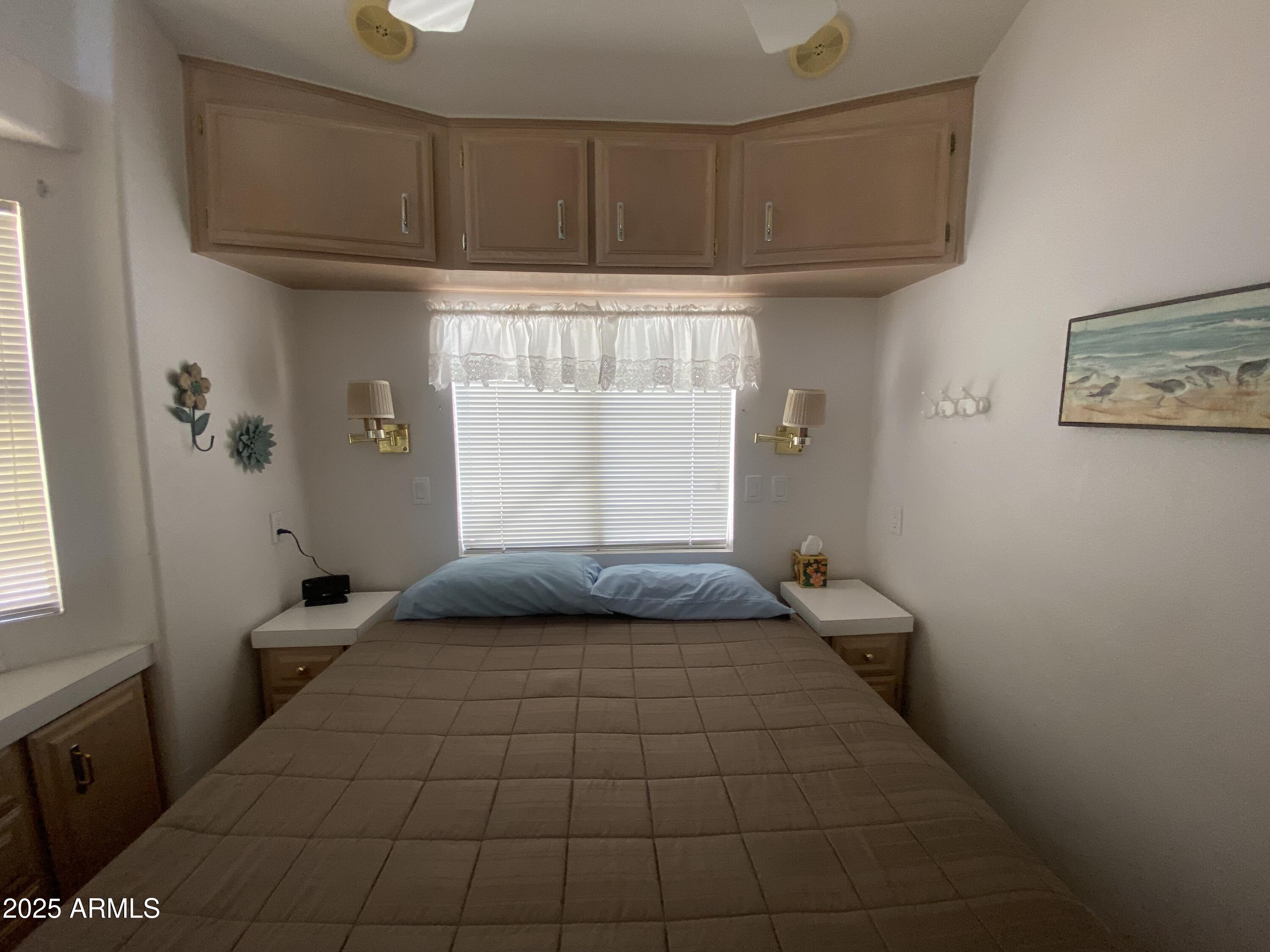 2072 West Klamath Avenue Apache Junction, AZ 85119 - Photo 17 of 25 a bedroom with a bed and a window