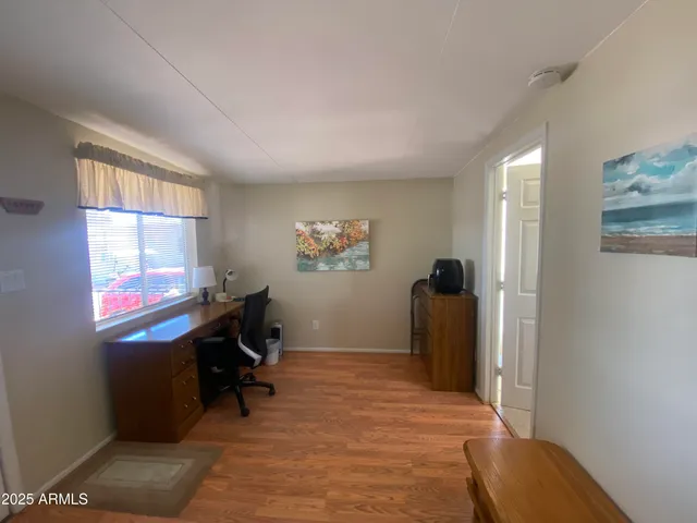 a workspace with furniture and window