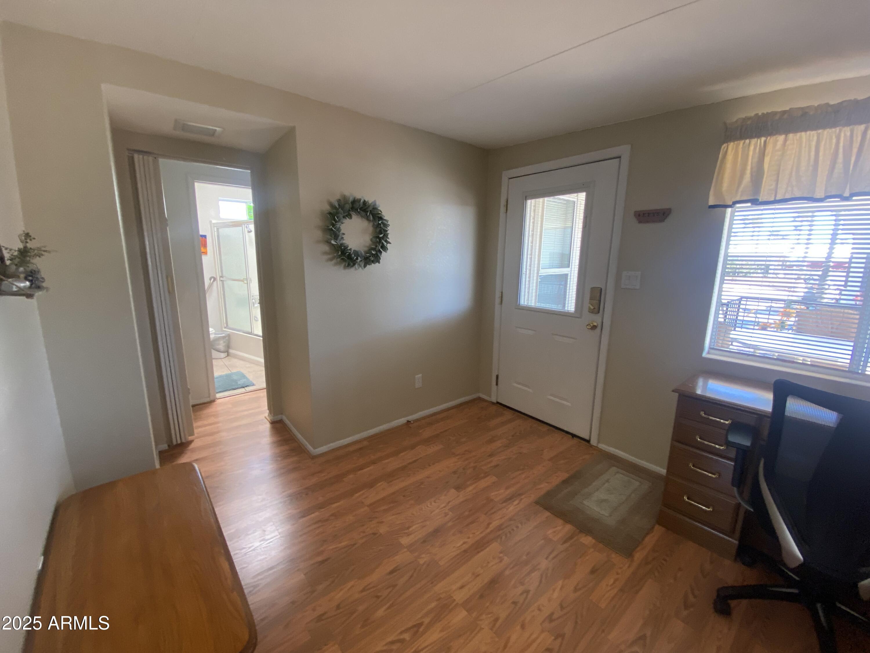 2072 West Klamath Avenue Apache Junction, AZ 85119 - Photo 21 of 25 a view of a room with wooden floor and windows