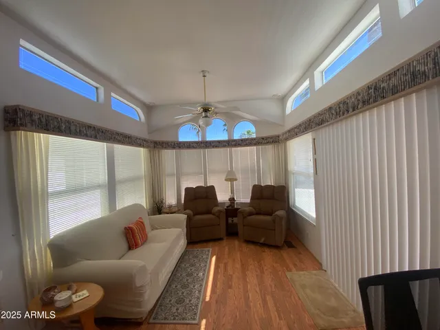 a living room with furniture and a large window
