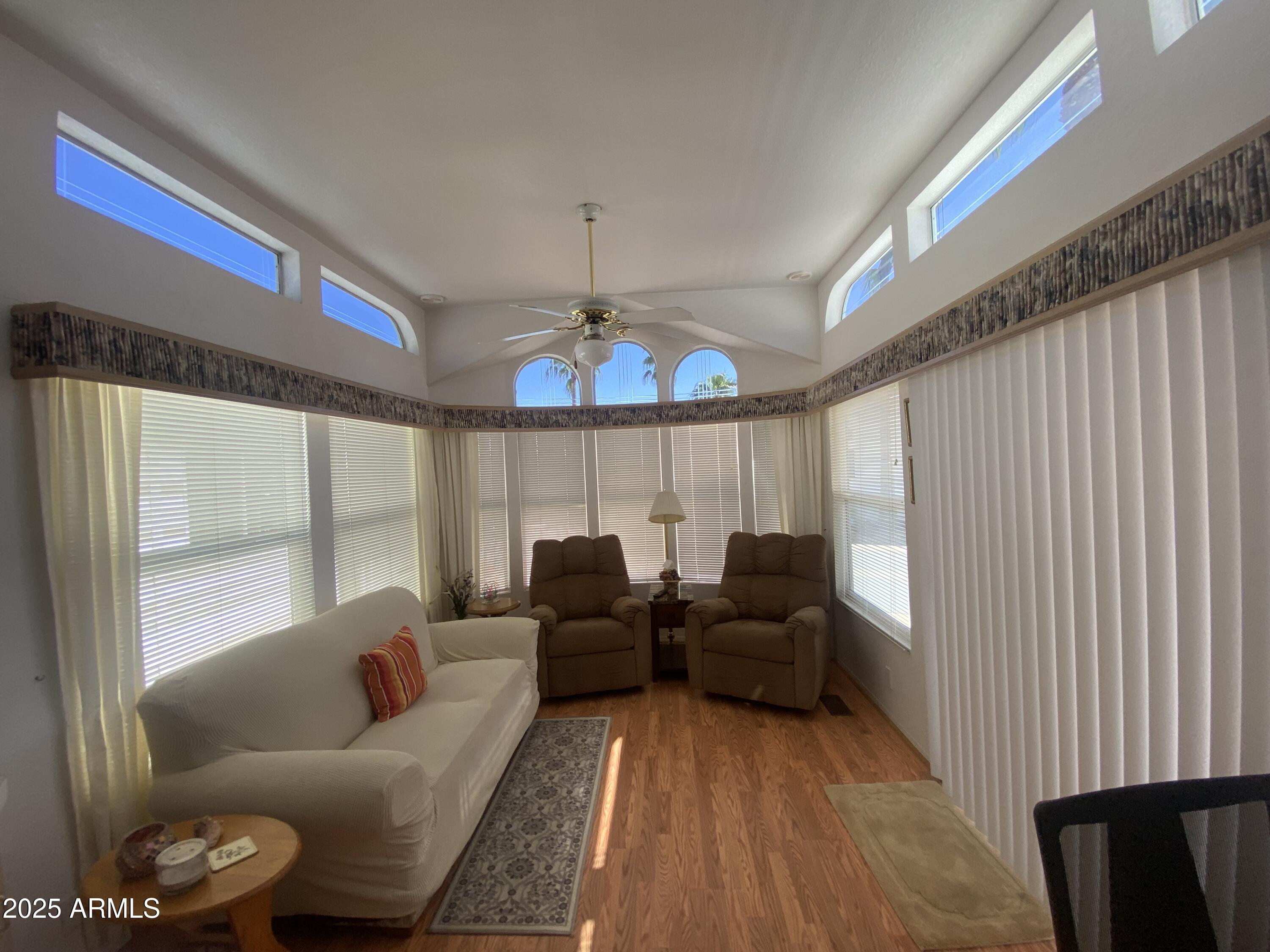 2072 West Klamath Avenue Apache Junction, AZ 85119 - Photo 3 of 25 a living room with furniture and a large window