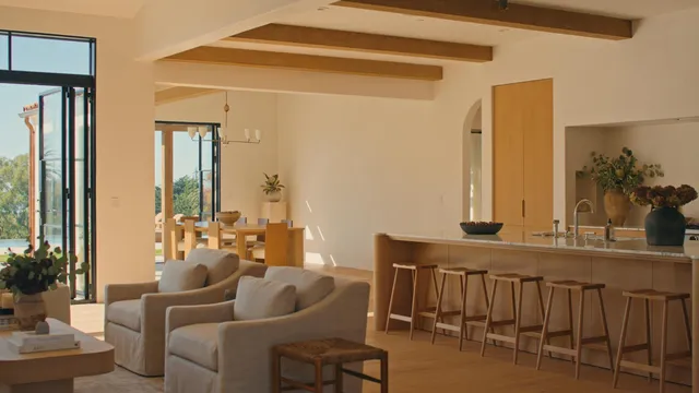 a view of a white house with a swimming pool and yard