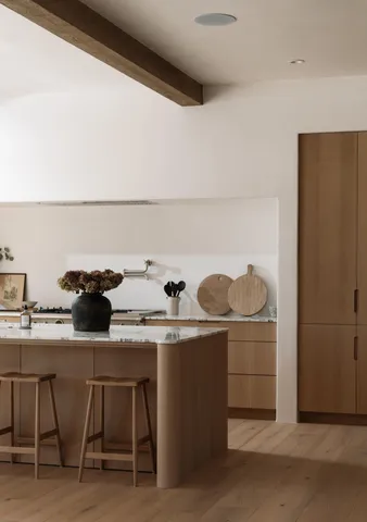 a dining room with a table and chairs