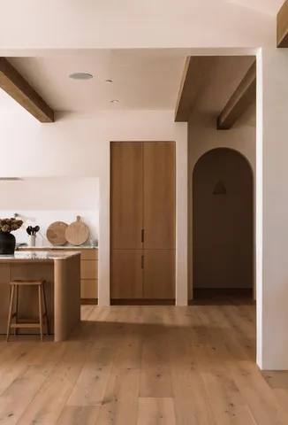 a view of a room with a wooden door