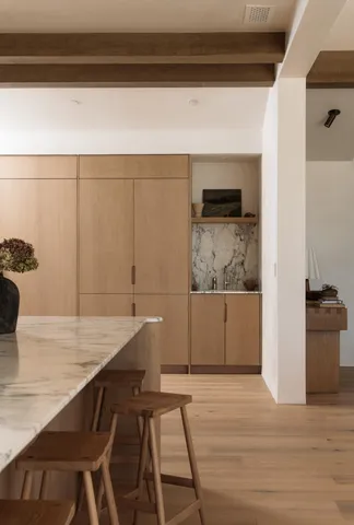 a view of entryway with window and hallway