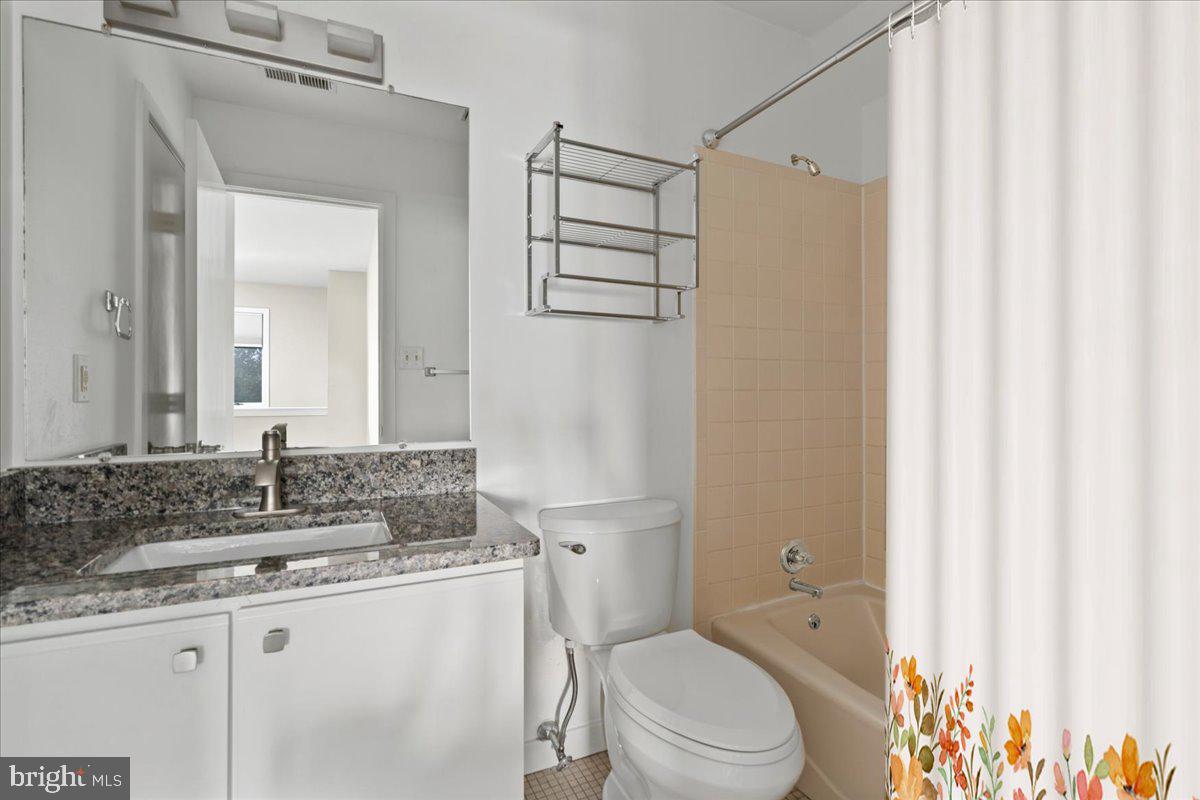 1 Center Street Doylestown, PA 18901 - Photo 12 of 12 a bathroom with a granite countertop sink toilet and shower