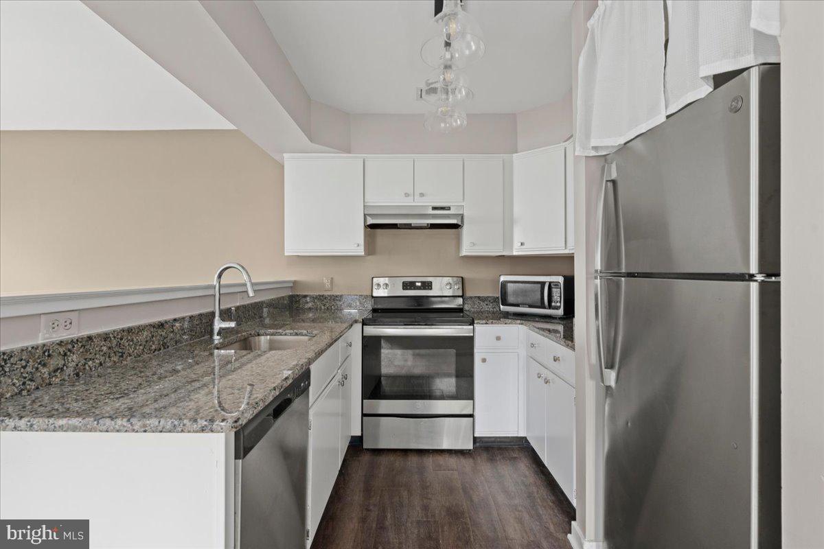 1 Center Street Doylestown, PA 18901 - Photo 9 of 12 a kitchen with a refrigerator sink and cabinets