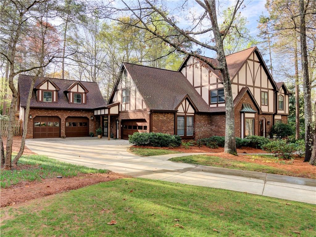 669 Gunby Road Southeast Marietta, GA 30067 - Photo 1 of 1 Soft Tudor with classic detailing situated on large lot in one of East Cobb’s most active friendly neighborhoods.