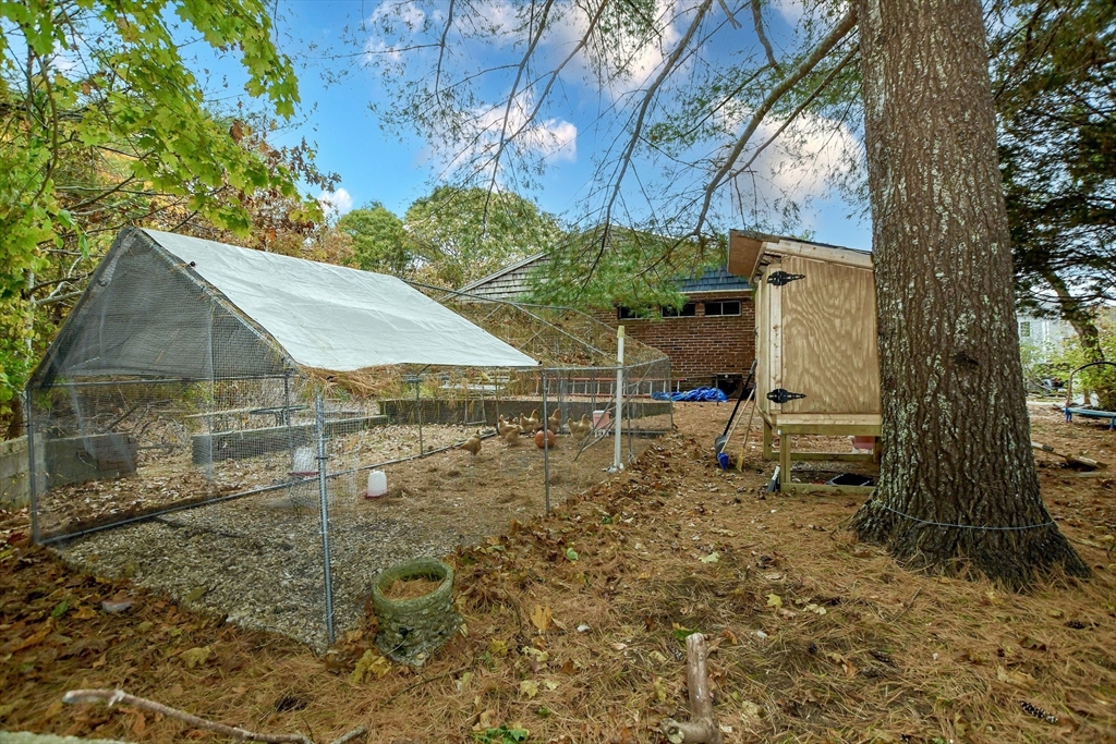 6 Gilbert Way Wareham, MA 02571 - Photo 28 of 42 a backyard of a house with table and chairs