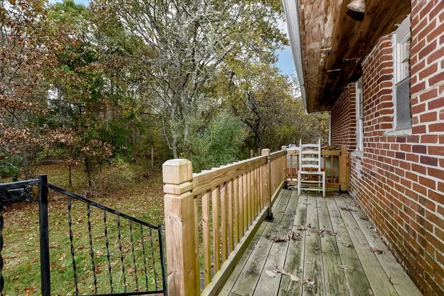 a view of outdoor space with deck and furniture