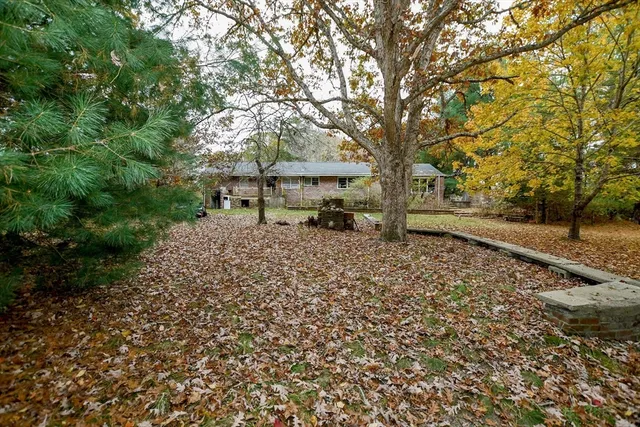 a backyard of a house with lots of green space
